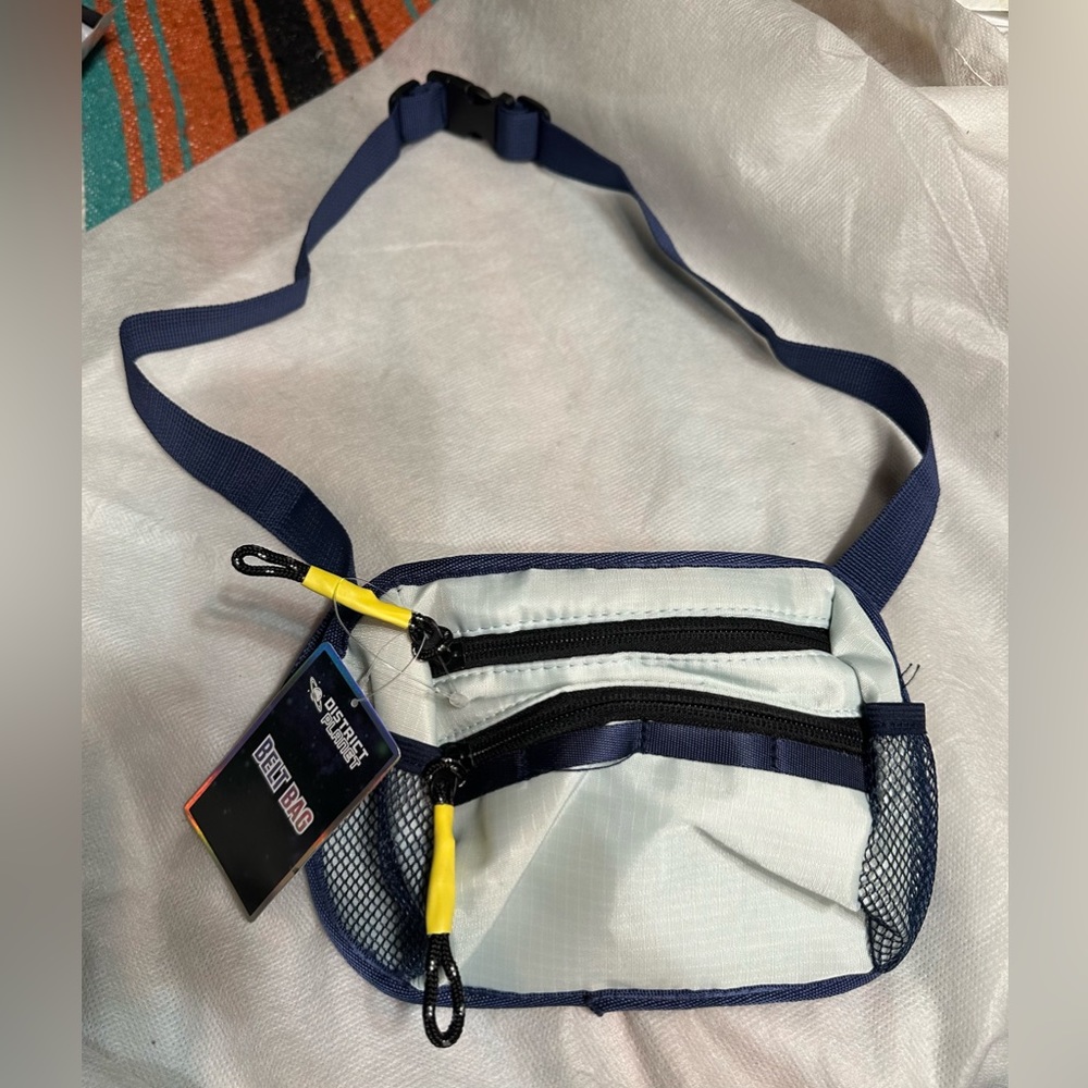 Navy Belt Bag. 2 zipper pockets, 2 side mesh pockets and loops. New with tags